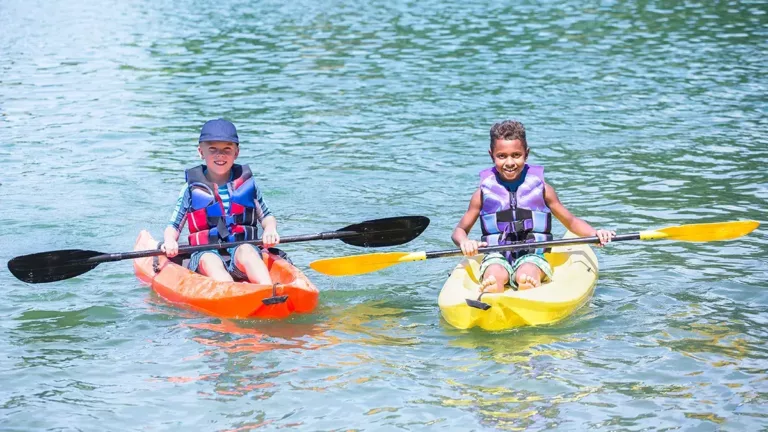 two kids kayaking