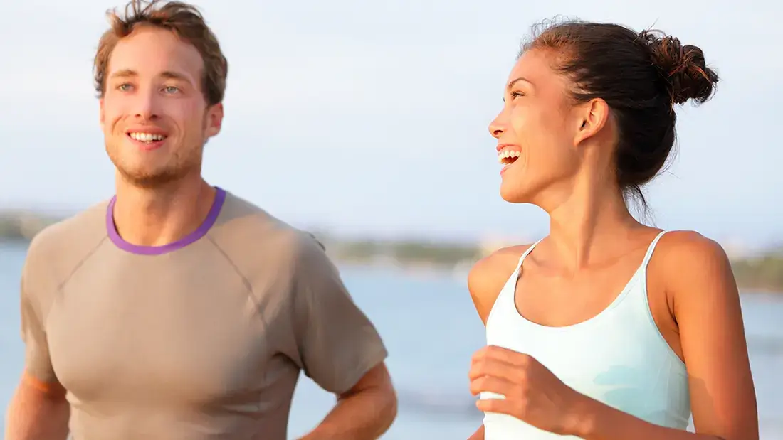 couple jogging along De Anza's path