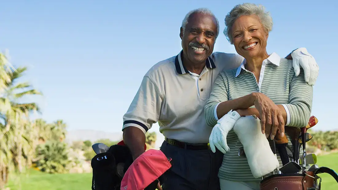 older couple golfing